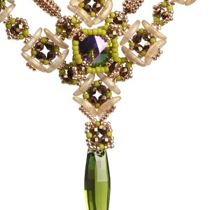 May include: A green and gold beaded necklace with a large green crystal pendant.