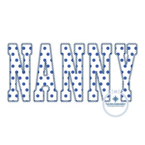 May include: A blue and white polka dot embroidery design of the word "NANNY".