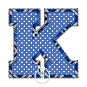 May include: Blue and white polka dot fabric letter K with a black and white plaid border. The letter is outlined with a black stitch.