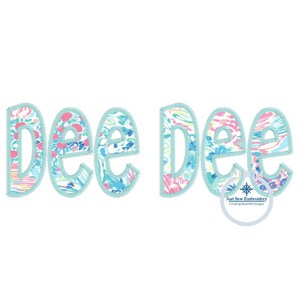 May include: The name "Dee Dee" is spelled out in large, outlined letters. The letters are filled with a colorful, abstract pattern. The letters are a light blue color.