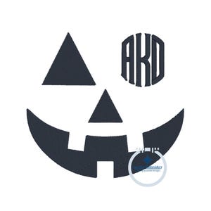 May include: Black and white embroidery design of a jack-o'-lantern face with a monogram in the eye. The monogram is the letters "AKD".