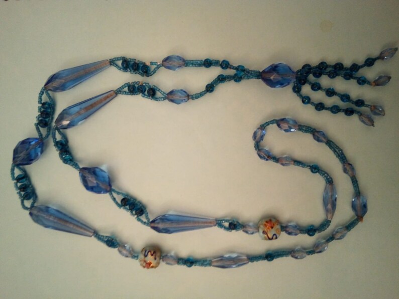 1930s long two tone blue crystal glass beads with 2 Venetian wedding cake beads.