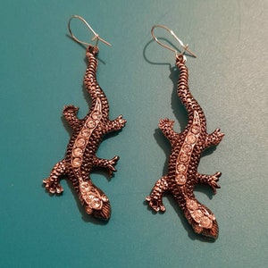 Handing lizards, pierced earrings