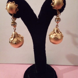 Brushed gold toned down ball clip earrings