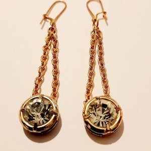 Bezel set diamonti hanging from gold tone chain pierced earrings