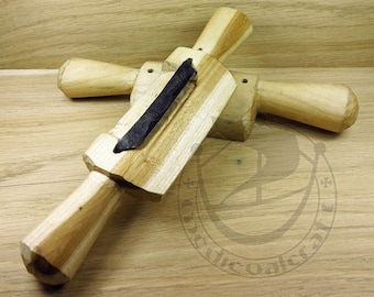 May include: Two wooden hand planes with a metal blade. The planes are made of light wood and have a natural finish. The blades are black and are visible in the image.