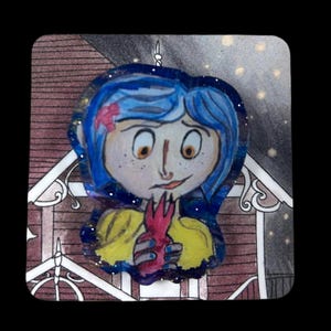 May include: A hand-drawn illustration of a girl with blue hair, wearing a yellow top and holding a red object. The artwork has a whimsical style, with a starry background and a decorative border. The girl has freckles and a small pink flower in her hair.