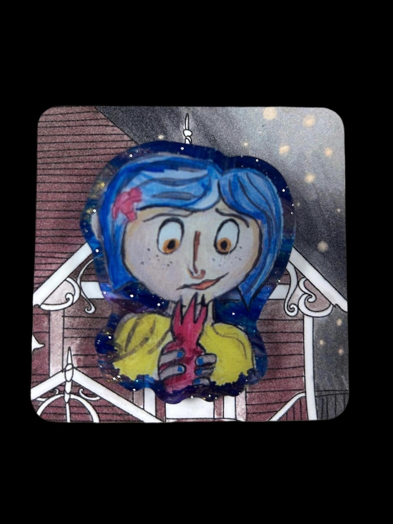 May include: A hand-drawn illustration of a girl with blue hair, wearing a yellow top and holding a red object. The artwork has a whimsical style, with a starry background and a decorative border. The girl has freckles and a small pink flower in her hair.