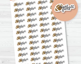 May include: Sheet of stickers featuring brown footballs and the words "football game" in a handwritten font. The stickers are arranged in rows and columns on a white background. The Orange Umbrella Co. logo is in the upper left corner.