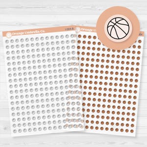 May include: Two sheets of basketball-themed stickers. One sheet features black and white basketball outlines, while the other has orange basketballs. A circular sticker with a basketball graphic is also visible.