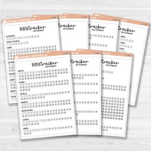 May include: A stack of Bible trackers from Orange Umbrella Co. The trackers are printed on white paper with a peach-colored border. Each tracker has a list of books and numbers for tracking reading progress.