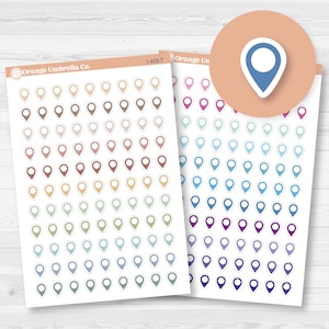 May include: Sheets of location pin stickers in various colors, including brown, pink, green, blue, and purple. The stickers are arranged in rows and columns. The brand name "Orange Umbrella Co." is printed on the top left corner of the sheet.