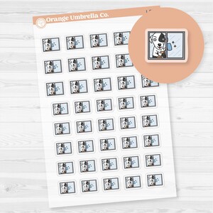 May include: Sheet of stickers featuring a cartoon dog with a black and white coat, cleaning a window. The stickers are rectangular and have a light blue background. The Orange Umbrella Co. logo is in the top left corner.