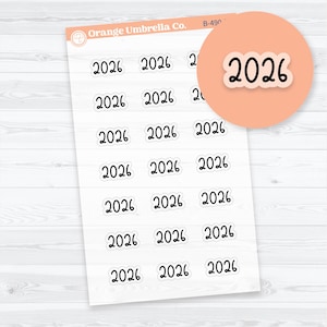 May include: Sheet of white stickers with the number "2026" in a black, handwritten font. The stickers are in a cloud-like shape. The Orange Umbrella Co. logo is in the upper left corner, and a peach-colored circle with the number "2026" is in the upper right corner.
