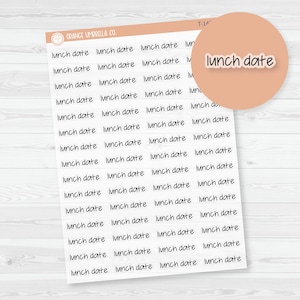 May include: A sheet of planner stickers from Orange Umbrella Co. featuring the text "lunch date" in a handwritten style. The stickers are white with black text and are arranged in rows. A peach-colored circle with the words "lunch date" is in the upper right.