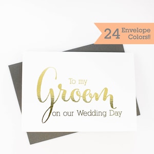 May include: A white greeting card with gold foil lettering that reads "To my Groom on our Wedding Day." The card is on a dark gray envelope. The image includes a banner that says "24 Envelope Colors!!"
