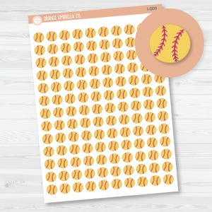May include: Sheet of softball stickers. Each sticker is a yellow softball with red stitching. The stickers are arranged in a grid pattern on a white background. A circular inset shows a close-up of a single softball sticker.