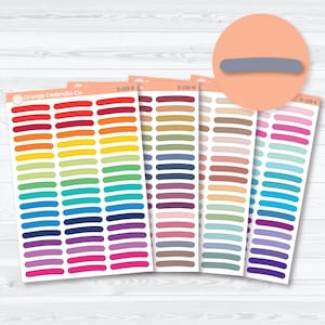 May include: A selection of sticker sheets from Orange Umbrella Co. displaying rows of coloured horizontal lines. The colour range includes red, orange, yellow, green, blue, purple, and pink. A circular graphic with a grey line is in the upper right.