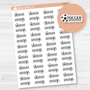 May include: A sheet of stickers featuring soccer balls and the words "Soccer Practice" in a script font. The stickers are black and white and arranged in rows and columns. The brand name "Orange Umbrella Co." is visible.