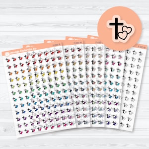 May include: Sheets of stickers featuring a cross and heart design in various colors. The stickers are arranged on white sheets with an orange header. The image includes a circular sticker with a black cross and heart design.