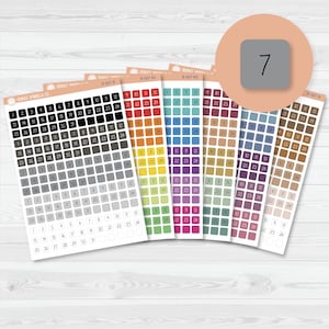 May include: Sheets of colorful planner stickers with dates, in various colors. Each sheet has a different color scheme, with dates from 1 to 31. A round sticker with the number 7 is in the upper right corner.