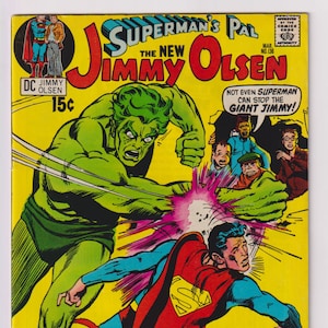 May include: A comic book cover featuring a green, muscular alien character punching Superman. The cover text reads "Superman's Pal The New Jimmy Olsen" and "Jimmy Olsen The D.N. Alien!"