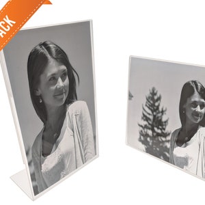 May include: A 12-pack of clear acrylic photo frames. Each frame is designed to hold a 4x6 inch photo and features a slanted stand for tabletop display.