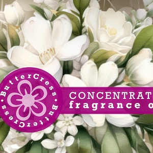 Puede incluir: Primer plano de un ramo de flores blancas con hojas verdes. La imagen tiene un círculo rosa con el texto "ButterCress.ButterCress" y una pancarta rosa con el texto "CONCENTRATED fragrance oil".