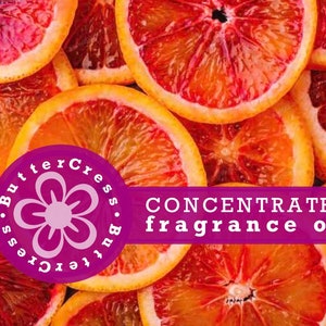 May include: Close-up of blood orange slices, with a purple circle logo that says "ButterCress.ButterCress" and a white flower in the center. The text "CONCENTRATED fragrance oil" is in white letters on a purple background.