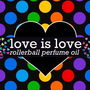May include: A black background featuring a pattern of colorful polka dots in blue, green, yellow, orange, and red. A large black heart with a white outline sits in the center, overlaid with a black horizontal banner reading love is love rollerball perfume oil.