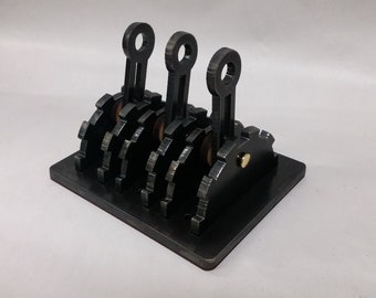 Steam punk style giant wall switch levers. Triple switch style.