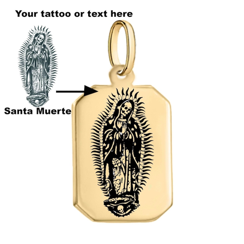 May include: Gold pendant necklace featuring a black and white image of Santa Muerte, a female figure with a skull face, wearing a robe and halo. The pendant is rectangular with rounded corners and has a bail at the top.