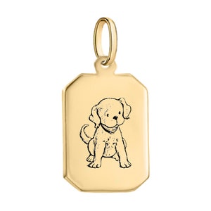 May include: Gold-colored dog tag charm with a black and white illustration of a puppy sitting. The tag has a rounded rectangular shape with slightly rounded corners.