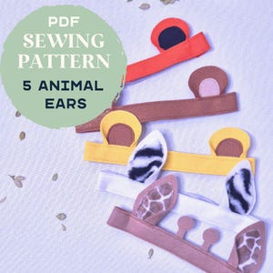 May include: A collection of five handmade animal ear headbands in various colors, including red, brown, yellow, white, and tan. The image includes text that reads "PDF Sewing Pattern 5 Animal Ears."