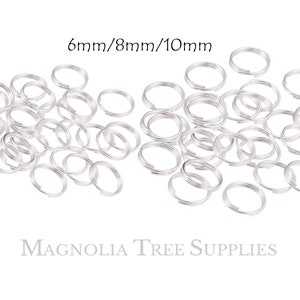May include: A pile of silver jump rings in three sizes: 6mm, 8mm, and 10mm.  The jump rings are a popular jewellery making supply.