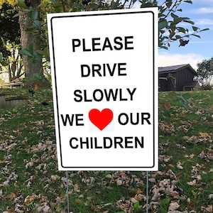 Please Drive Slowly, We Love Our Children Lawn Sign