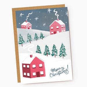 Tarjeta de felicitación navideña de casas nevadas