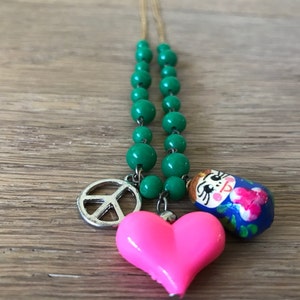 Green Glass Beaded Necklace with 3-pendants: Peace, Heart & Matrushka, Yellow GF