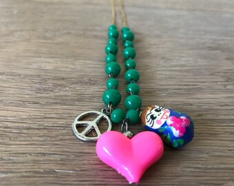 Green Glass Beaded Necklace with 3-pendants: Peace, Heart & Matrushka, Yellow GF