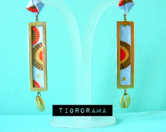 May include: A pair of gold earrings with a blue and red patterned fabric insert and a gold seashell charm hanging from each earring.