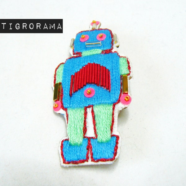 broche brodée main robot bleu et rouge