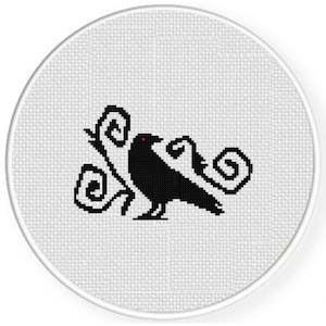 May include: Black and white cross stitch pattern of a raven with red eyes and swirling designs.