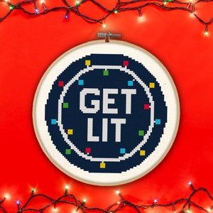 May include: A blue and white embroidery hoop with the text "GET LIT" surrounded by a circle of colorful lights.