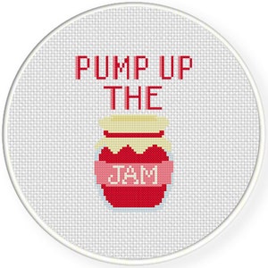 May include: Cross-stitch design featuring a red jar of jam with a pink label that reads "JAM." The text "PUMP UP THE" is above the jar in red letters. The design is set against a white background within a round frame.