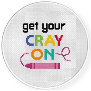 May include: A white round embroidery hoop with the phrase "get your crayon on" in colourful letters and a pink crayon drawn below.