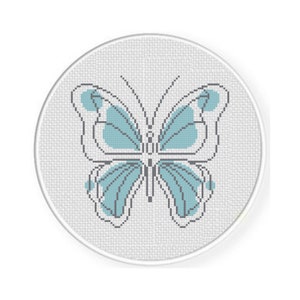 May include: A blue butterfly with gray outlines is embroidered on a white circular canvas.