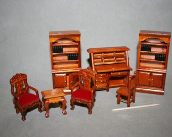 May include: A miniature dollhouse furniture set featuring a wooden desk with a hutch, two bookcases, two chairs, and a small table. The furniture is painted in a rich brown color and has a traditional style.