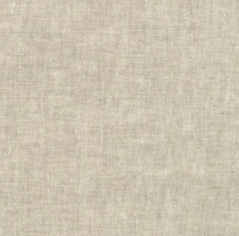 May include: A close-up of a plain, off-white linen fabric with a subtle woven texture.