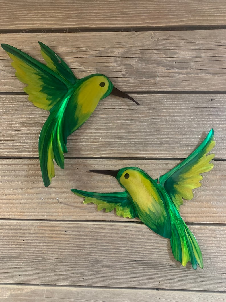 Lime, yellow and green hovering and inflight metal hummingbird metal art.