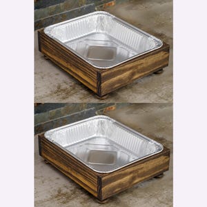 May include: Two wooden trays with aluminum foil pans inside. The trays are stained a dark brown color and have four small legs.